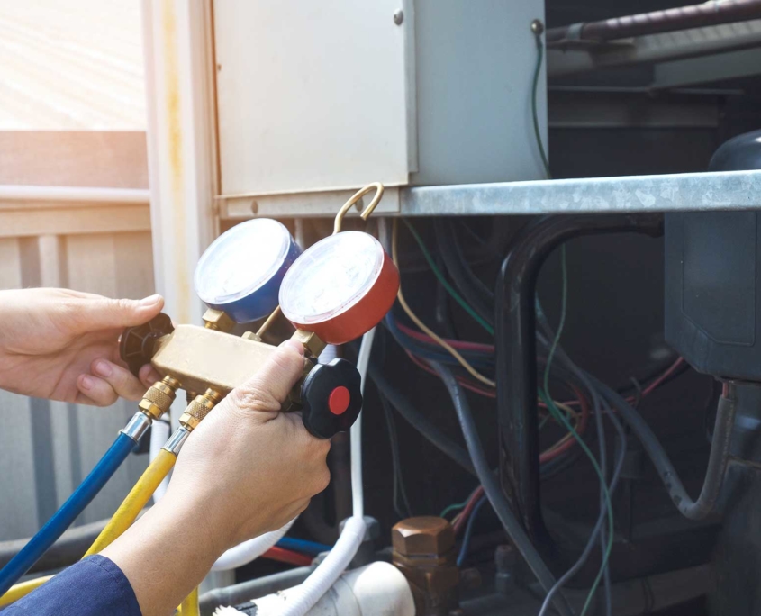 hands shown holding a device to check on the hvac system hands shown holding a device to check on the hvac system